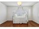 Serene bedroom with a canopy bed and hardwood floors at 2460 Oldfield Rd, Atlanta, GA 30327