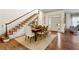 Spacious entryway with hardwood floors, staircase, and dining area at 2460 Oldfield Rd, Atlanta, GA 30327