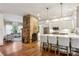 Open concept kitchen and living area with a stone fireplace as a focal point at 2460 Oldfield Rd, Atlanta, GA 30327