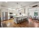 Open concept kitchen boasts stainless steel appliances and an island at 2460 Oldfield Rd, Atlanta, GA 30327