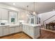 Spacious kitchen featuring a large island, stainless steel appliances, and white shaker cabinets at 2460 Oldfield Rd, Atlanta, GA 30327