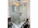 This bathroom features a glass shower with modern tiling and a rainfall shower head at 2622 Marcia Dr, Lawrenceville, GA 30044