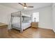 This bedroom features a bunk bed, laminate floors, and a window at 2622 Marcia Dr, Lawrenceville, GA 30044