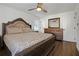 Spacious bedroom with wood floors, a decorative bed frame, dresser, and a ceiling fan at 2622 Marcia Dr, Lawrenceville, GA 30044