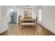 Dining room with modern chandelier, hardwood floors, and a stainless steel refrigerator in the background at 2622 Marcia Dr, Lawrenceville, GA 30044