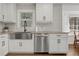 Bright kitchen featuring white cabinets, stainless steel appliances, granite countertops, and hexagon tile backsplash at 2622 Marcia Dr, Lawrenceville, GA 30044