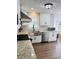 Well-lit kitchen with stainless steel appliances, white cabinets, and hexagon tile backsplash at 2622 Marcia Dr, Lawrenceville, GA 30044