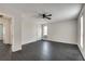 Spacious bedroom with dark gray flooring, ceiling fan, and two windows at 5815 Feldwood Rd, Atlanta, GA 30349