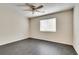 Spacious bedroom with dark gray flooring and ceiling fan at 5815 Feldwood Rd, Atlanta, GA 30349