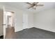 Bright bedroom with dark gray flooring and ceiling fan at 5815 Feldwood Rd, Atlanta, GA 30349