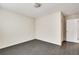 Well lit bedroom with dark gray flooring and closet at 5815 Feldwood Rd, Atlanta, GA 30349