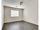 Simple bedroom with dark gray flooring and window blinds at 5815 Feldwood Rd, Atlanta, GA 30349