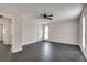 Spacious bedroom with dark gray flooring, ceiling fan, and two windows at 5815 Feldwood Rd, Atlanta, GA 30349