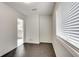 Simple dining room with dark gray flooring and a view into the kitchen at 5815 Feldwood Rd, Atlanta, GA 30349