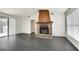 Living room with fireplace and dark gray floors at 5815 Feldwood Rd, Atlanta, GA 30349