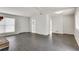 Spacious living area with dark gray flooring and an open concept layout at 5815 Feldwood Rd, Atlanta, GA 30349