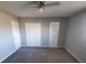 Primary bedroom with double closets and neutral walls at 6354 Shannon Pkwy # 6C, Union City, GA 30291