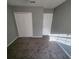 Bedroom with double closets and neutral walls at 6354 Shannon Pkwy # 6C, Union City, GA 30291