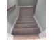 Carpeted stairs leading to basement at 6354 Shannon Pkwy # 6C, Union City, GA 30291