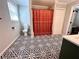 Bathroom with patterned floors, a white toilet, and a decorative shower curtain at 212 Teepee Trl, Whitesburg, GA 30185