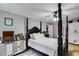Cozy bedroom featuring a four-poster bed, stylish decor, and plenty of natural light at 212 Teepee Trl, Whitesburg, GA 30185