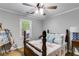 Charming bedroom with a cozy bed, warm lighting, and inviting decor at 212 Teepee Trl, Whitesburg, GA 30185