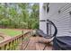Relaxing deck with wooded backyard views at 212 Teepee Trl, Whitesburg, GA 30185