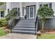 Charming front entrance featuring gray steps and a decorative glass front door at 212 Teepee Trl, Whitesburg, GA 30185
