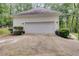 Detached garage with a large driveway at 212 Teepee Trl, Whitesburg, GA 30185