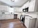 Fully updated kitchen with stainless steel appliances and white cabinets at 212 Teepee Trl, Whitesburg, GA 30185