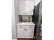 Modern kitchen with cabinets, granite countertops, and decorative glass vases at 212 Teepee Trl, Whitesburg, GA 30185