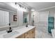 Modern main bathroom with double vanities, and a glass-enclosed shower at 212 Teepee Trl, Whitesburg, GA 30185