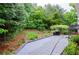 Landscaped backyard with patio and grill at 2120 Shaffer Rd, Cumming, GA 30041
