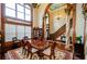 Formal dining room features hardwood floors, a large table, and a view of the entryway at 2120 Shaffer Rd, Cumming, GA 30041