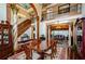 Elegant dining room with hardwood floors, large table, and access to the living room at 2120 Shaffer Rd, Cumming, GA 30041