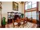 Formal dining room with hardwood floors, large windows, and a formal table at 2120 Shaffer Rd, Cumming, GA 30041