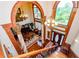 Grand two-story entryway with hardwood floors, columns, and chandeliers at 2120 Shaffer Rd, Cumming, GA 30041