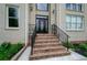 Elegant front entrance with stone steps and wrought iron railings at 2120 Shaffer Rd, Cumming, GA 30041