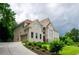 Two-story brick house with attached garage and manicured lawn at 2120 Shaffer Rd, Cumming, GA 30041