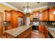 Spacious kitchen with granite countertops, stainless steel appliances, and custom wood cabinetry at 2120 Shaffer Rd, Cumming, GA 30041