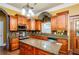 Kitchen with granite countertops, wood cabinets and stainless steel appliances at 2120 Shaffer Rd, Cumming, GA 30041
