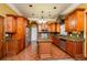 Island kitchen with stainless steel appliances and dark wood cabinets at 2120 Shaffer Rd, Cumming, GA 30041