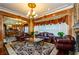Living room boasts leather furniture, a fireplace, and hardwood floors at 2120 Shaffer Rd, Cumming, GA 30041