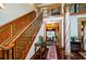 Impressive wooden staircase with wrought iron railing and ornate detailing at 2120 Shaffer Rd, Cumming, GA 30041