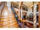 Elegant staircase in a two-story foyer with hardwood floors at 2120 Shaffer Rd, Cumming, GA 30041