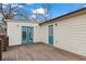 Exterior featuring wood deck, french doors and fresh siding at 2409 Swallow Se Cir, Atlanta, GA 30315