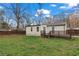 Spacious backyard featuring wooden deck, partial fence and grass at 2409 Swallow Se Cir, Atlanta, GA 30315