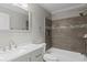 Nicely updated bathroom with a shower-tub combination and a modern vanity at 2409 Swallow Se Cir, Atlanta, GA 30315