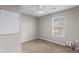 Neutral bedroom featuring a ceiling fan and natural light from a window at 2409 Swallow Se Cir, Atlanta, GA 30315