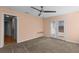 Bedroom featuring carpeted floors, ceiling fan, and access to a deck at 2409 Swallow Se Cir, Atlanta, GA 30315